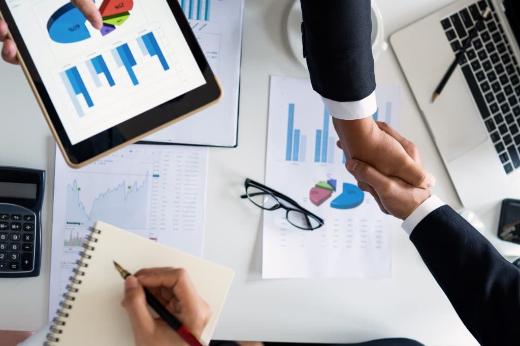 Operator reviewing business reports at a clean desk
